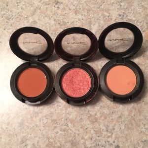 Duo of MAC cosmetic peach toned eyeshadows.